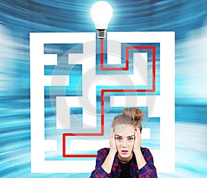 Teen girl and a maze with a light bulb