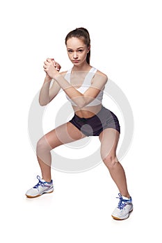 Teen girl measuring her waist with a measuring tape