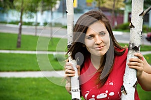 A teen girl near the tree