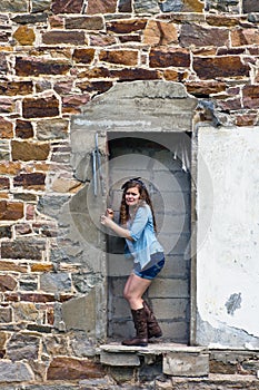 Teen Girl outside old building
