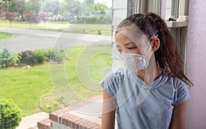 Teen girl during pandemic using face mask . Copy space.