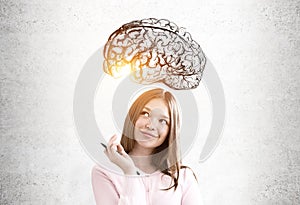 Teen girl in pink and a brain sketch photo