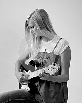 Teen girl playing guitar