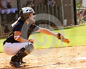 Teen girl playing softball photo