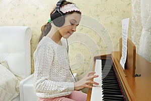 Teen girl playing on synthesizer melody, put photo