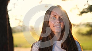 teen girl portrait in the park. close-up a girl child in nature. happy family teenager concept. happy girl smiling