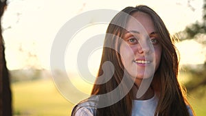 teen girl portrait in the park. close-up a girl child in nature. happy family teenager concept. happy girl smiling