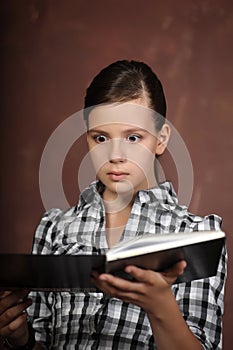 Teen girl reading a book