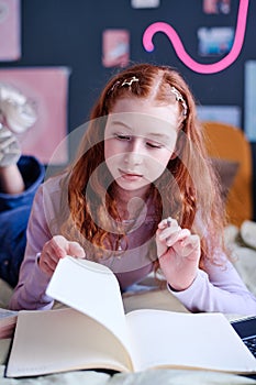 Teen Girl Reading Notes