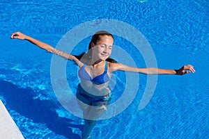 Teen girl relaxing near swimming pool