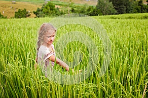 Teen girl on the rice paddies photo