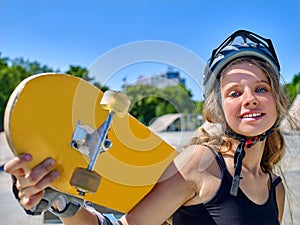 Teen girl rides his skateboard