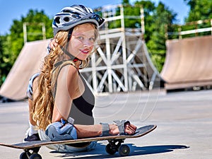 Teen girl rides his skateboard