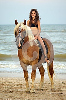 Teen girl riding a horse