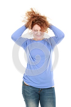 Teen girl running hands through hair