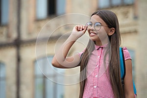 Teen girl in school outdoor. Back to school. Education and knowledge. Knowledge day. Secondary education. Educational