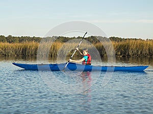 Teen girl sea kayaking