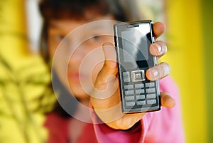 Teen girl showing her mobile phone