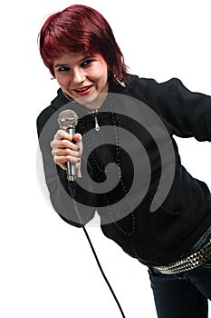 Teen girl singing with a microphone