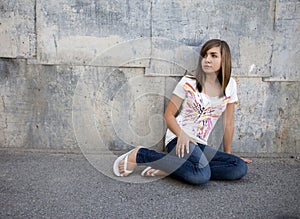 Teen Girl Sitting in Alleyway