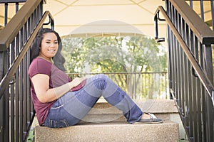 Teen Girl Sitting on Stairway