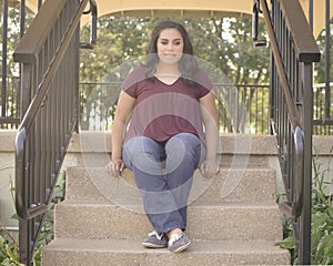 Teen Girl Sitting on Stairway
