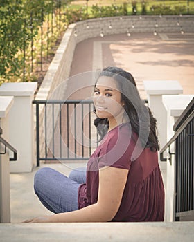 Teen Girl Sitting on Stairway