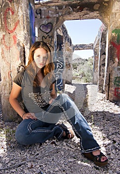 Teen Girl sitting in Urban Ruins