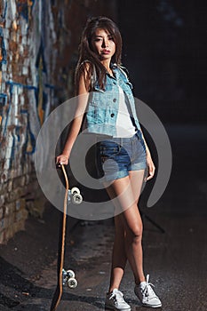 Teen girl with skate board