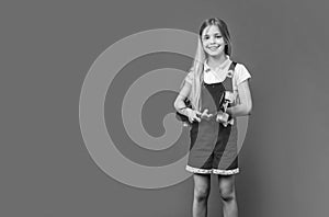 teen girl skateboarder in studio, copy space. teen girl skateboarder on background. teen girl skateboarder. teen girl photo