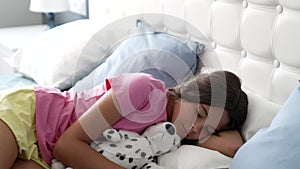 teen girl sleeping peacefully in bed with toy, childhood