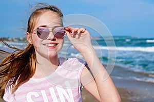 Teen girl smiling selfie vacation near sea