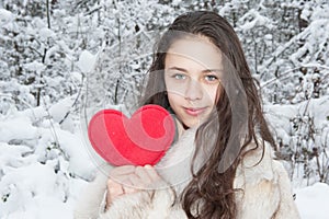 Teen girl in a snowy forest