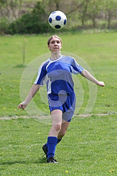 Teen Girl Soccer Player In Action