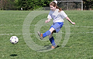 Teen Girl Soccer Player In Action