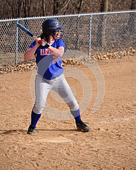 Teen Girl Softball Player Batting