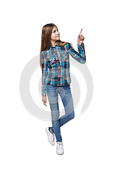 Teen girl standing casually pointing up