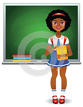 Teen girl standing in front of green school board with books