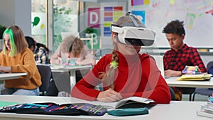 Teen girl study in vr headset in classroom