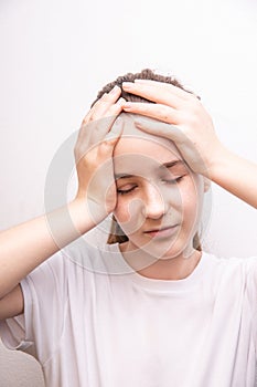 teen girl is suffering, girl covered head with hands, worry problems on white background