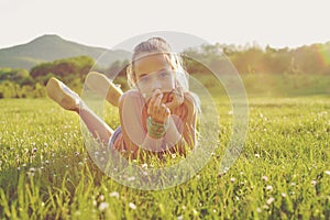 Teen girl on the sunny meadow