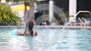 Teen girl swimming in pool