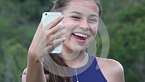 Teen Girl Taking Selfy With Cell Phone