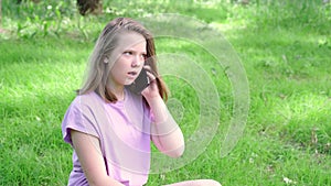 Teen girl talking on her mobile cell phone. Technology, communication and lifestyle concept
