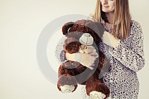 Teen girl with teddy bear