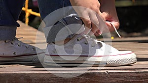 Teen Girl Tying Sneakers