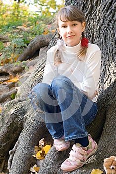 Teen girl under the tree