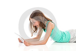 Teen girl using digital tablet