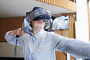 Teen girl using virtual reality gear