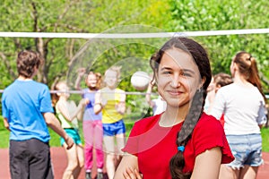 Teen girl at volleyball game on the playground